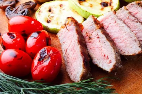 Close-up of marbled beef steak sliced on a cutting board Foto stock