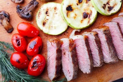 Close-up of marbled beef steak sliced on a cutting board Stock Photos
