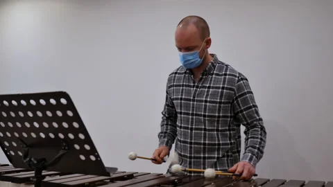 Close of a marimba played by the percussion section of band. male hands playing Stock Footage 145529518