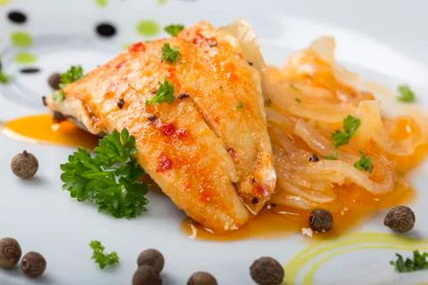 Close up of marinated fish with herbs Foto stock