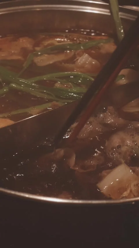 Close-up of marinated pork sizzling on a wire mesh gridiron over hot charcoal Video stock 344921935