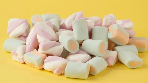 Close-up of marshmallows on a yellow background Stock Photos