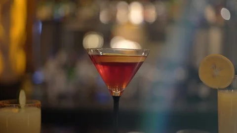 CLOSE UP TO A MARTINI IN A BAR Stock Footage 107288716