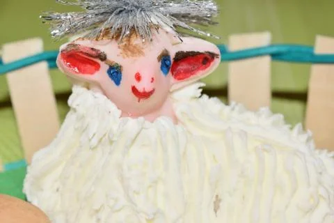 Close up of marzipan Easter lamb and fruit in a basket Photos