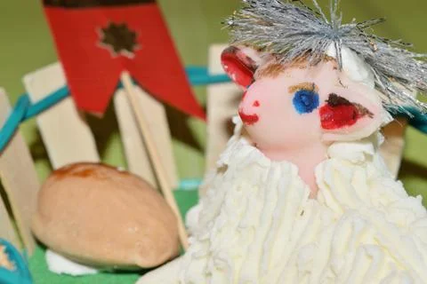 Close up of marzipan Easter lamb and fruit in a basket Photos