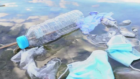 Close Up of Mask and Gloves Floating on the River. Environment Concept. Stock Footage 140404966