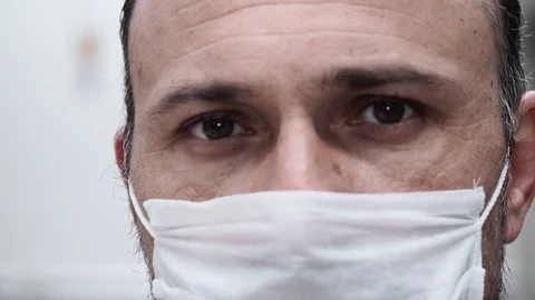 Close-up of the masked man's eye Video stock 128934053