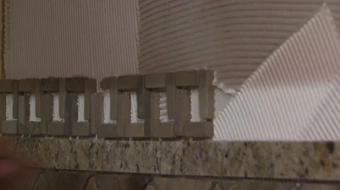 Close-up of mason attaching marble on wall Video stock 55570234