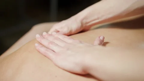 Close-up massage in the back area with two hands. Stock Footage 146138143