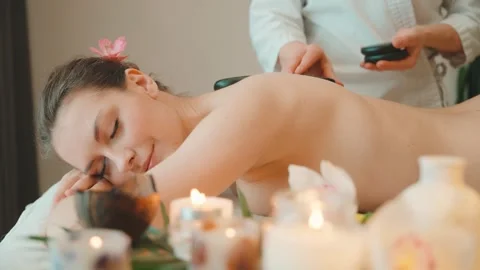 Close-up massage process hands female masseur massages body back adult beauty Stock Footage 311985077