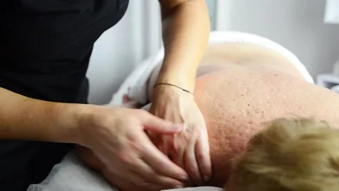 Close-up of a massage therapist performing a professional back massage Stock-Footage 342049736