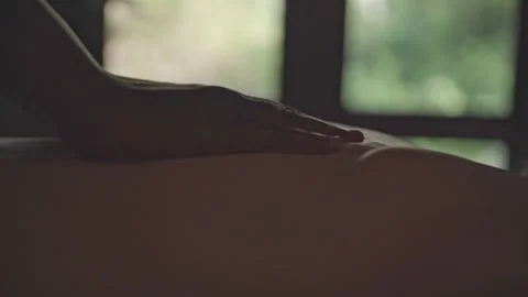 Close up of a masseuse giving a back massage Stock Footage 240923461