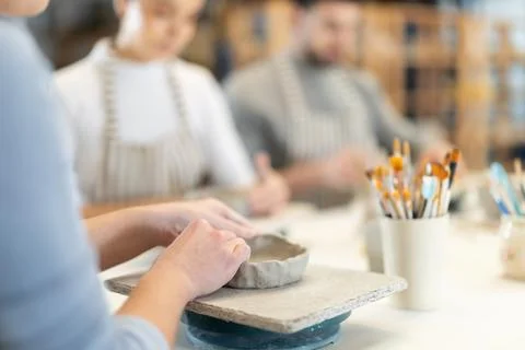 Close up master forms bowl of clay during master class Stock Photos