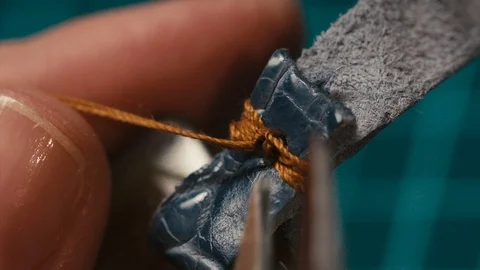 Close up of the master hands sews leather Video stock 73951683