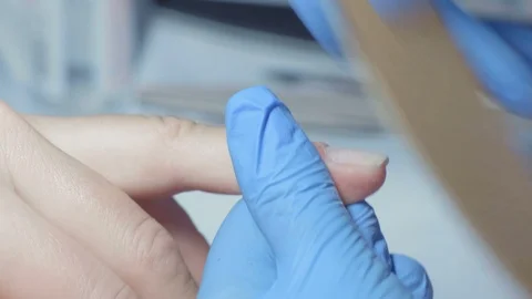 Close-up, Master Manicure Handles Nails on the Woman's Hand with the Use of a Stock Footage 97956630