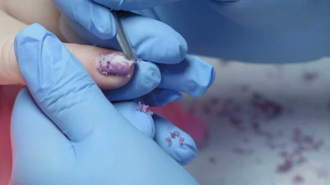 Close-up, Master Manicure Removes Old Nail Polish with Women Nail Stock Footage 97956373