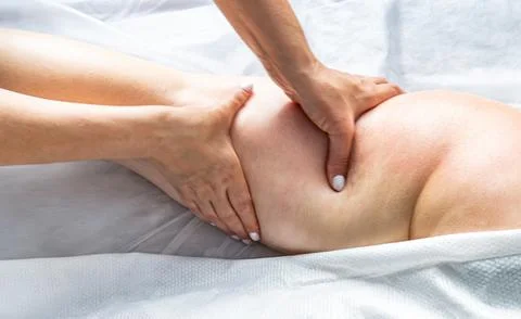 Close-up Master masseur performs anti-cellulite massage for girl. Procedure of Stock Photos