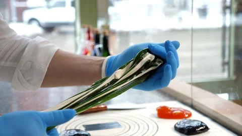 Close-up of a master pastry chef mixing caramel with his hands. Stock Footage 333246404