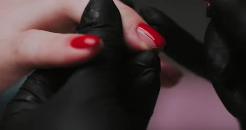 Close Up of master in rubber gloves covering red nails  Stock Footage 149367582