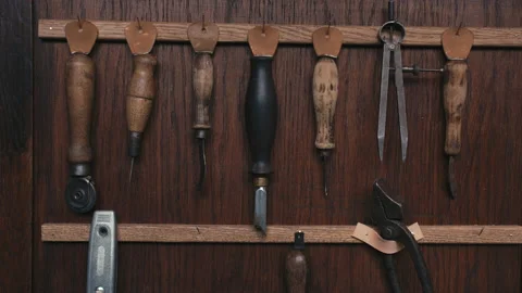Close-up master takes tools for making shoes.Craft production. Cinematic light Stock Footage 138261202