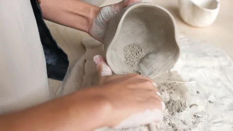 Close up of master's hand with a knife on the clay cut the edges of the pot 스톡 동영상 107582409