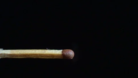 The close-up match breaks out and lights up with the help of a high-speed camera Vídeos de archivo 83998594