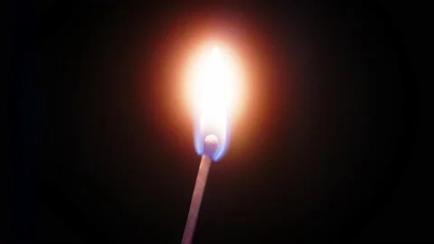 Close up of a match burning in slow motion Video stock 235913927