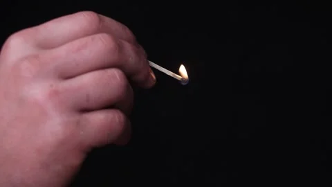 Close-Up of Match Lighting Up on Black Stock Footage 280960211