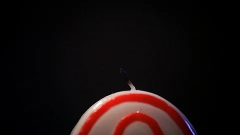 A close-up match lights a festive candle in the form of a number zero, beautiful Stock Footage 116467613