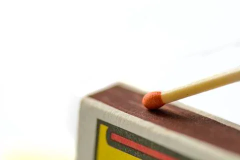 Close up of a match on a Scraping surface. Stock Photos