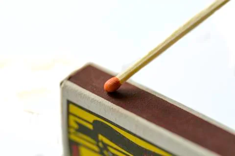 Close up of a match on a Scraping surface. Stock Photos