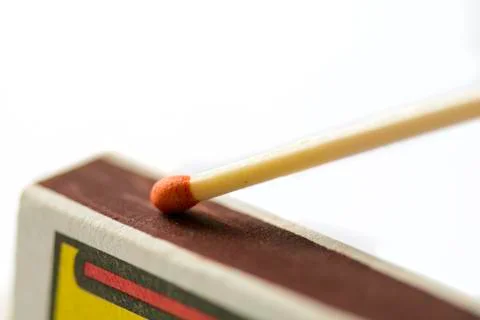 Close up of a match on a Scraping surface. Stock Photos
