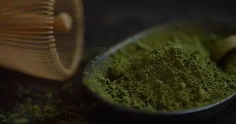 Close up matcha tea. Rotation 360 on black wood table. Matcha Organic Green Tea Video stock 125831237