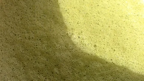 Close up of matcha texture with creamy foam and bubbles. Stock Footage 334132046