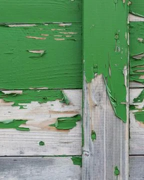 Close-up material texture of peeling green paint on wooden boards Stock Photos