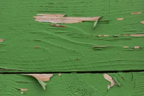 Close-up material texture of peeling green paint on wooden boards Stock Photos