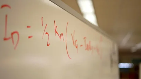 Close-up of math equations written on a dry-erase board. Stock Footage 99999064