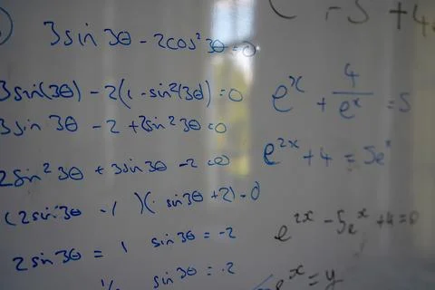 Close up of math, graphs and equations on a white board 库存照片