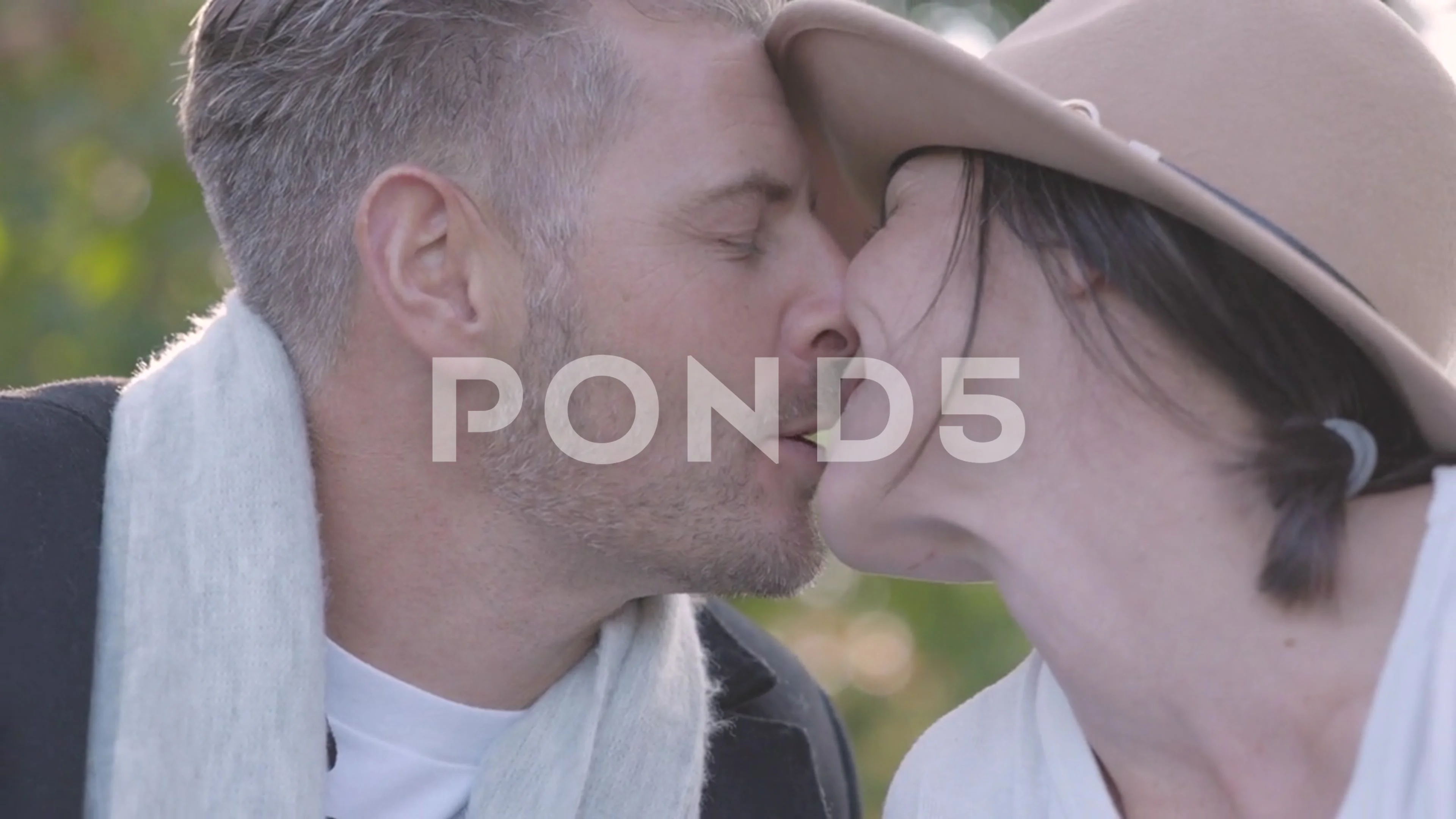 close up of a Mature Couple Enjoying a Kiss on a Date at the Park Together