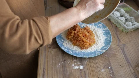 Close-up mature female hands preparing mincemeat for meatballs Stock Footage 105378540