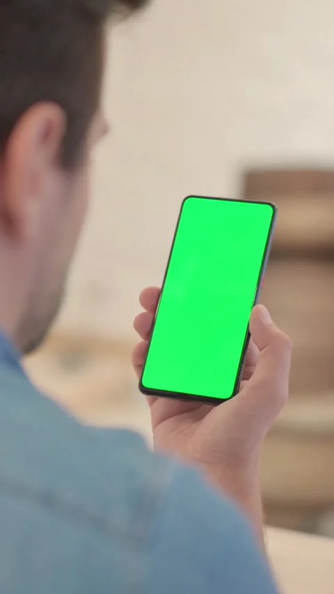 Close Up of Mature Man Using Phone with Green Screen, vertical video 库存影片 328564913