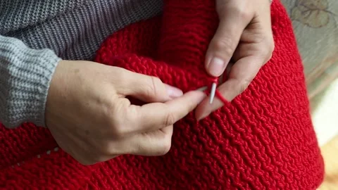 Close-up of a mature woman's hands knitting on knitting needles. Stock Footage 237736701