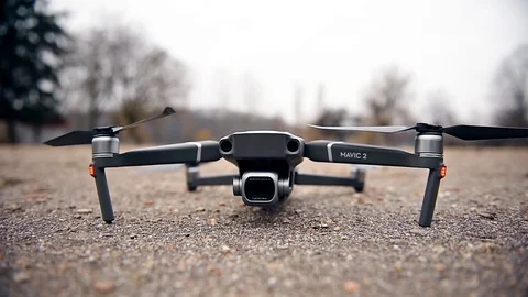 Close up with a Mavic 2 Pro drone initializing and taking off Stock Footage 102563414