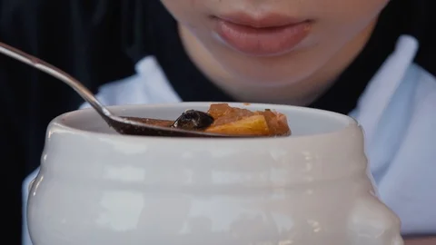 Close-up meal in a cafe. The boy eats at a cafe. Stock Footage 93521061