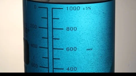 Close up of measuring beaker with blue liquid Stock Footage 95967638