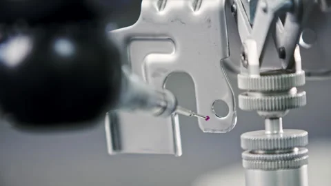 Close up of a measuring needle on a CNC machine that is used for testing Stock Footage 255219609