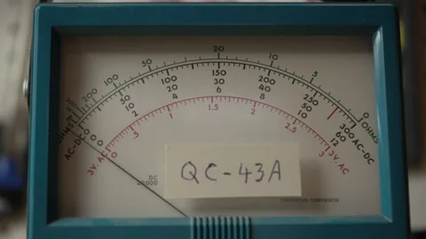 Close up - measuring voltage using a vintage analog voltmeter Stock Footage 201310935
