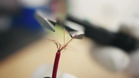 Close-up of measuring wire diameter with precision tool in a workshop Stock Footage 319503642