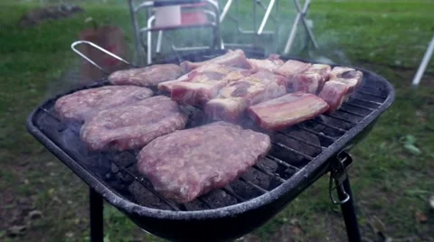 Close up of meat cooking on grill for summer bbq Stock-Footage 65133885