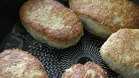 Close-up meat cutlets are fried in a frying pan Stock Footage 171988129
